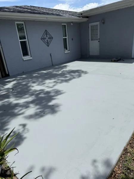 Light gray concrete patio beside a home