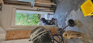 Concrete being placed in an interior renovation work area