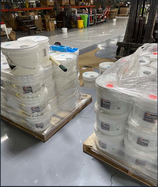 Palletized floor coating supplies in a warehouse