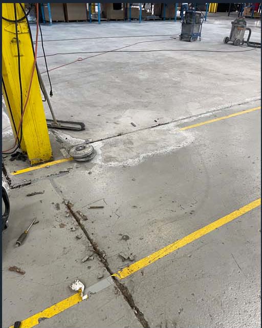 Concrete floor with yellow work-zone markings