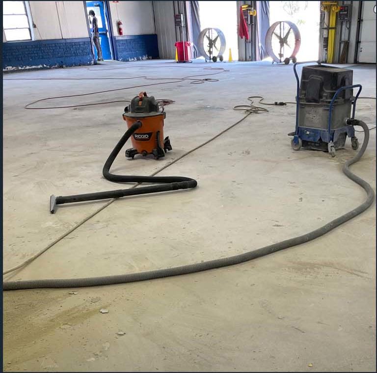 Floor preparation vacuum and equipment on a concrete slab