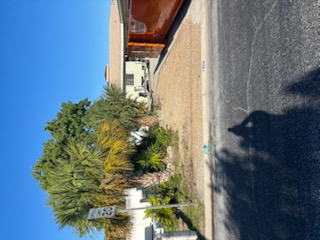 Street-side yard where grade, drainage, and landscape meet